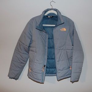 Blue north face puffer jacket